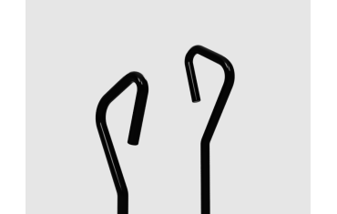 angular bent tube hand grab rails in black metal. the metal is bent around on itself to create a handle.